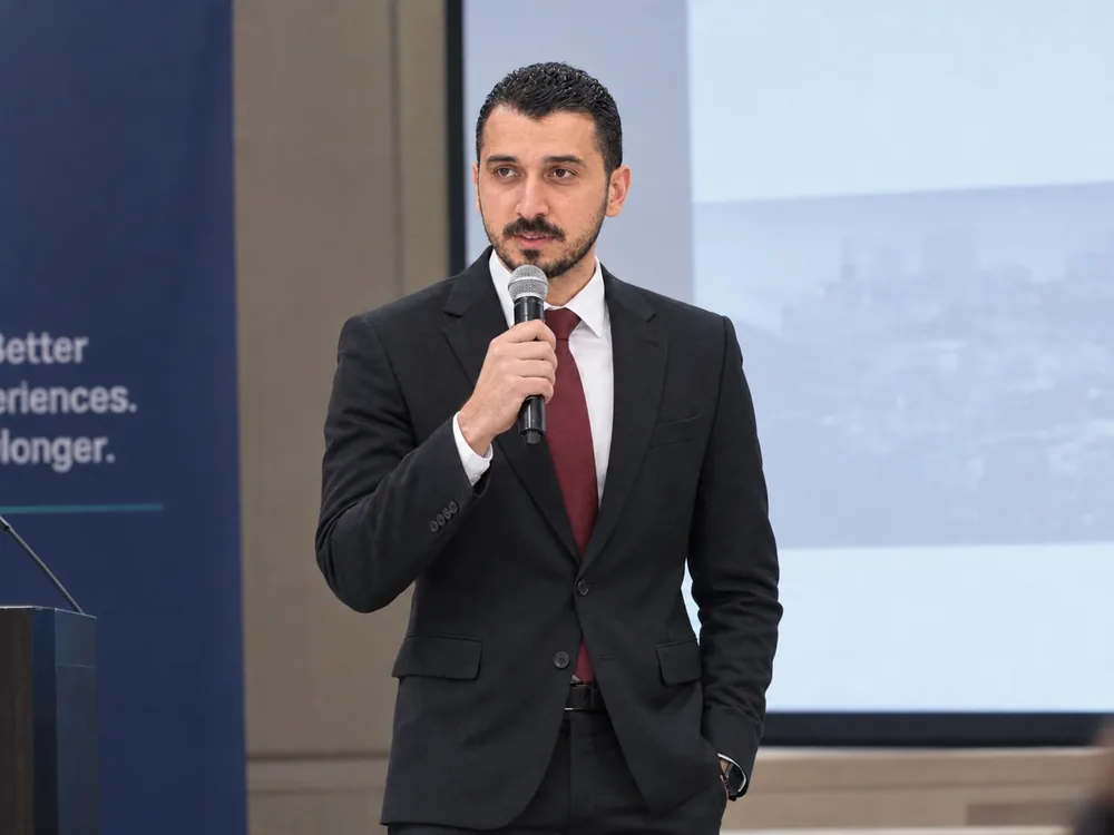 Mohammad Musallam speaking into a microphone